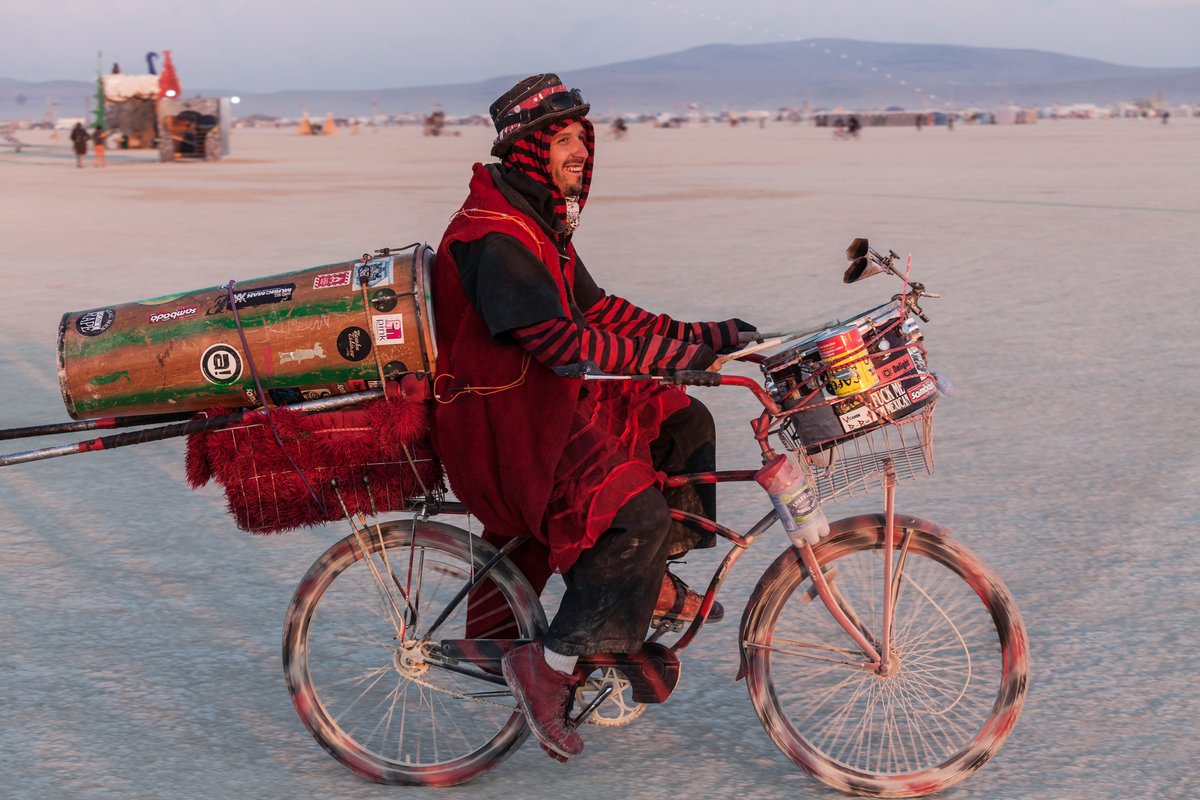 Drumming Burner on his bike.