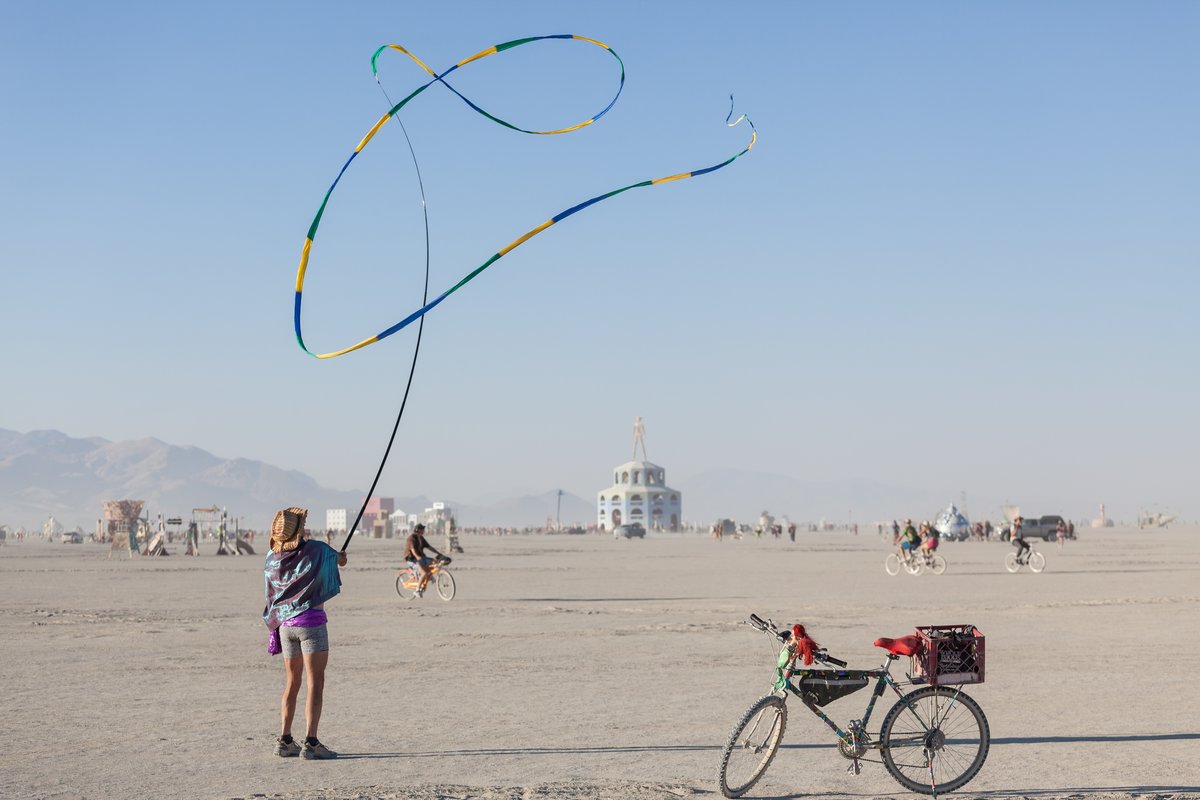 Artistic ribbon twirling and the man.