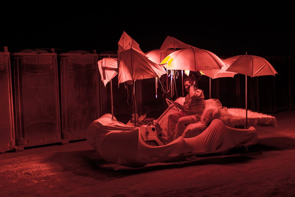 Art car with umbrellas at the toilets.