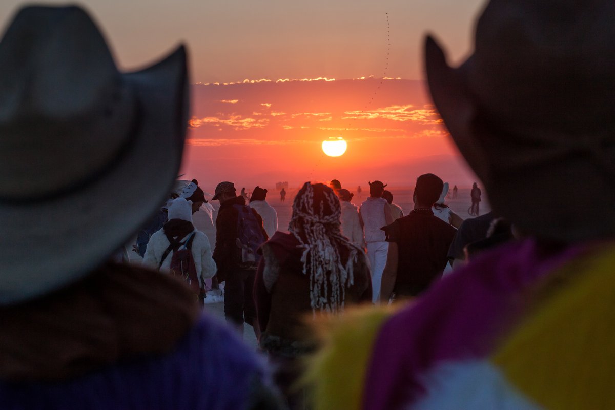 Cowboy hats and sunrise.