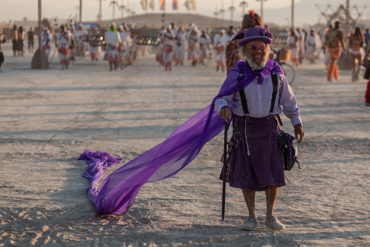 Happy Man With A Fantastic Purple Cape