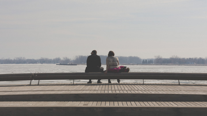 Man And Woman On A Bench