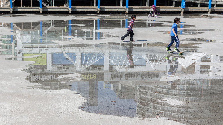 Children Playing On Melted Ice Rink