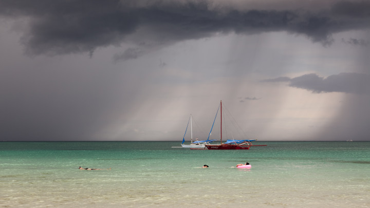 Sweeping Rain And Relaxed Swimmers