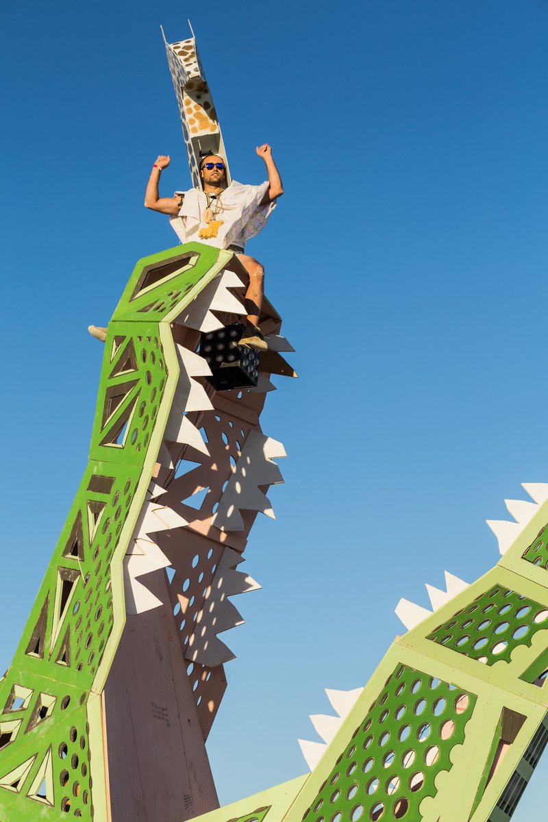 A Man In A Giraffe Costume Climbs On Big Al - Big Al by Brennan Steele | New Orleans, LA
