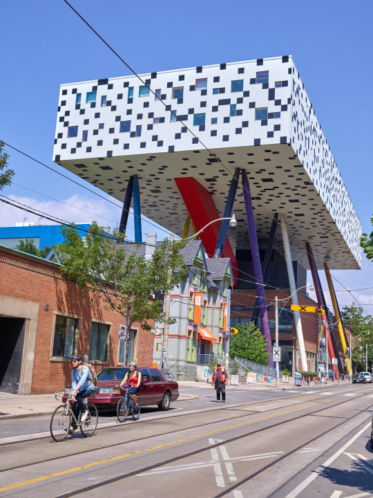 Cyclists In Front Of The Ontario College of Art and Design