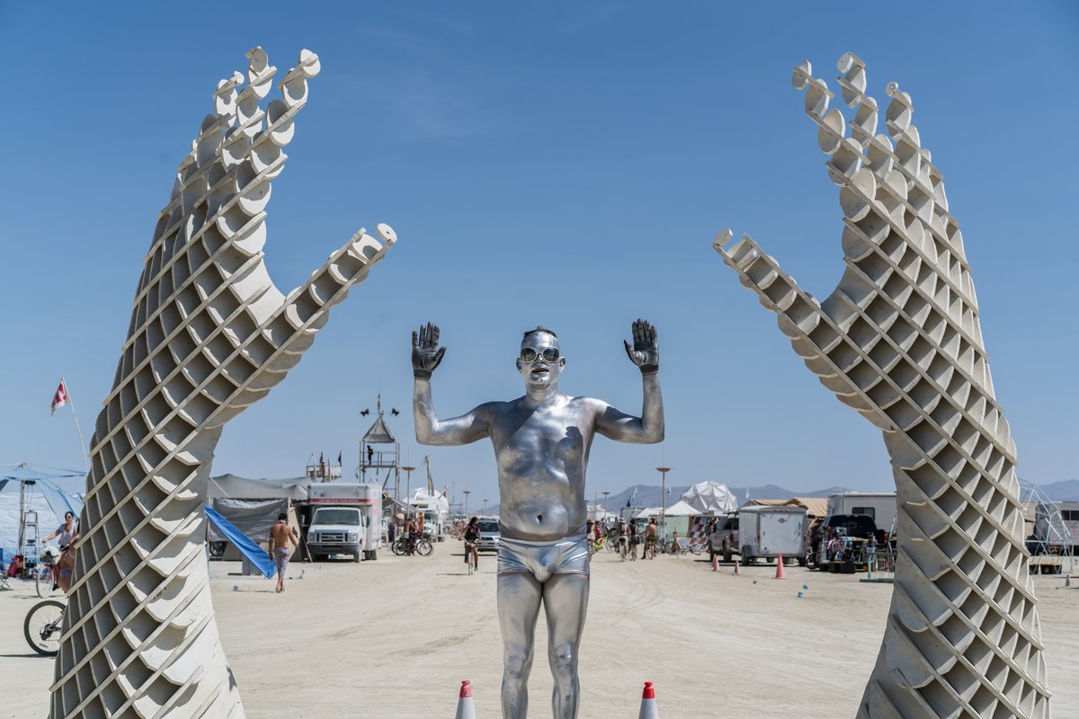 Silver Guy And Hands At 730 Pavilion