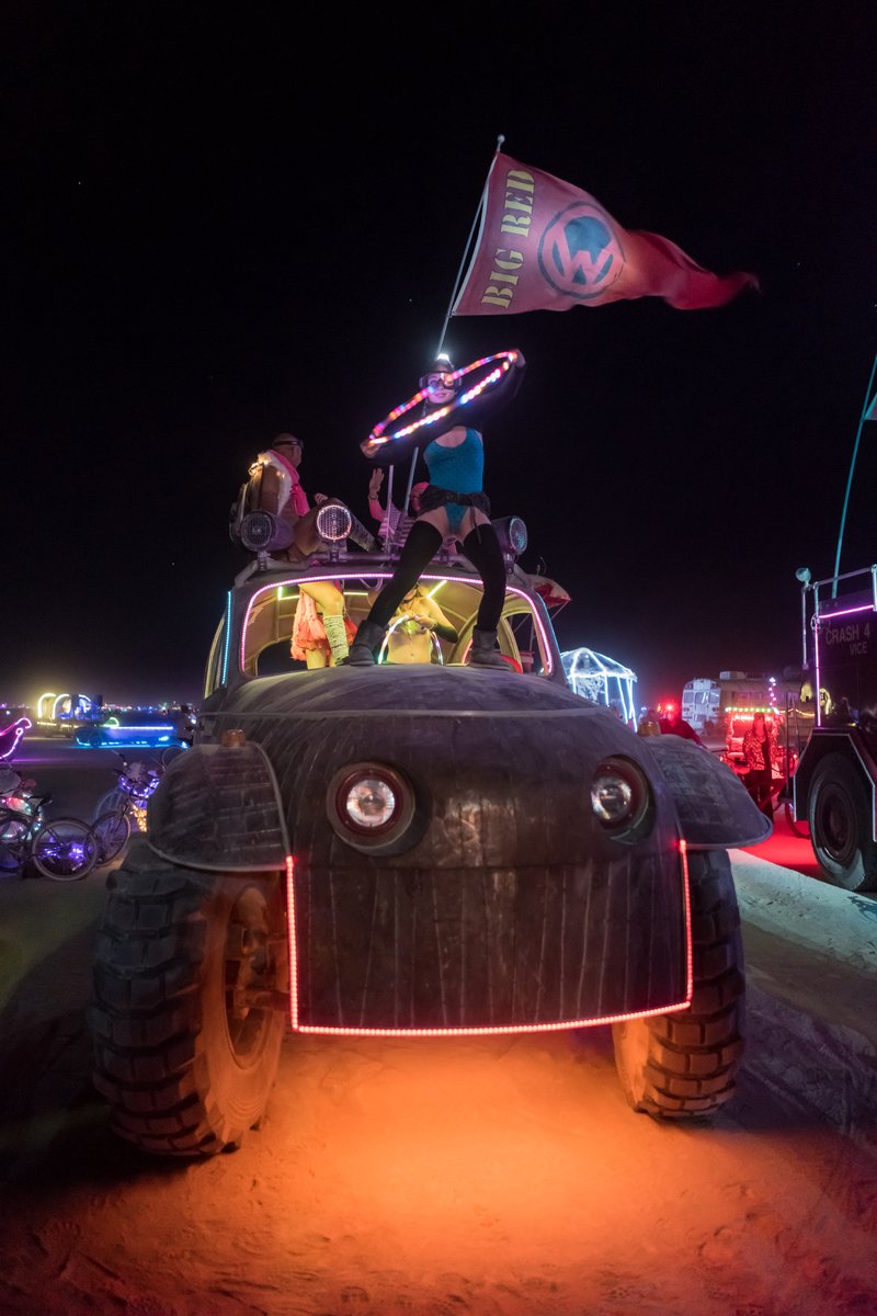 Burner Hula Hooping Atop The Big Red VW Bug
