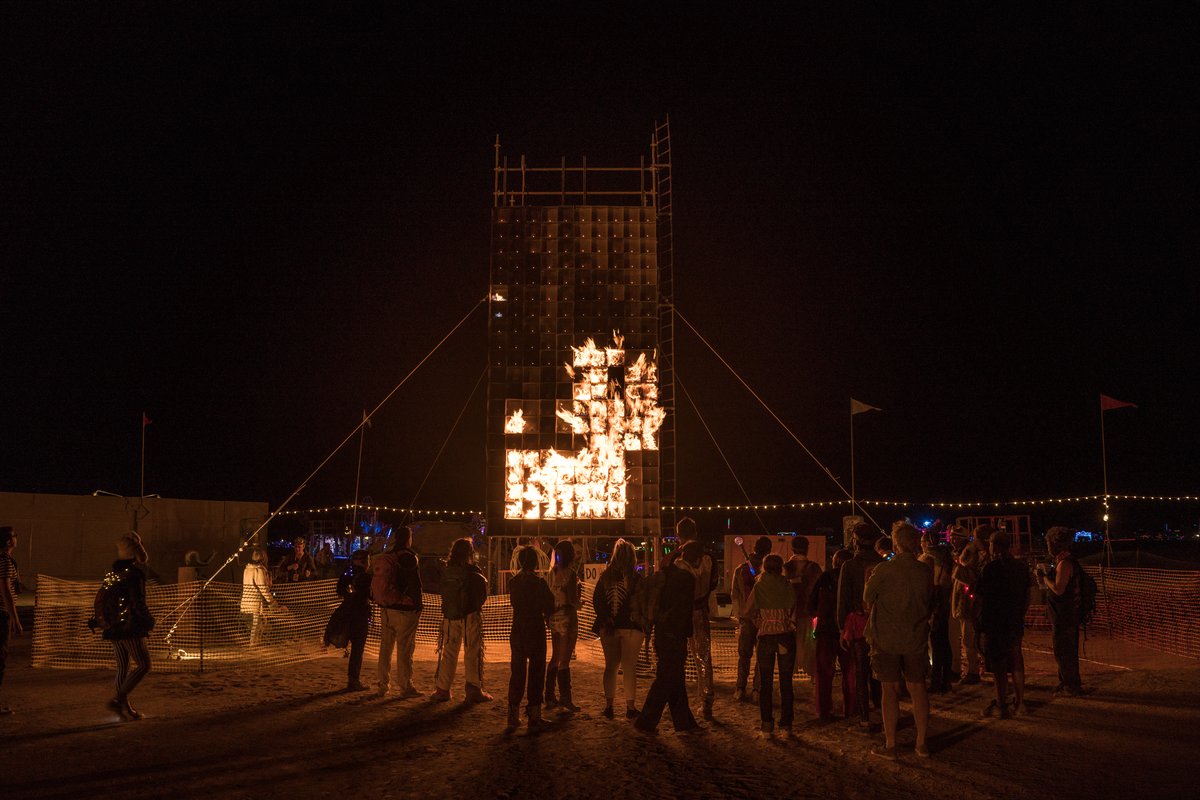 A Crowd Gathers To Watch The Epic Fire Tetris by Jody McIntyre Being Played info@firetetris.com http://burningman.org/event/brc/2015-art-installations/#FireTetris