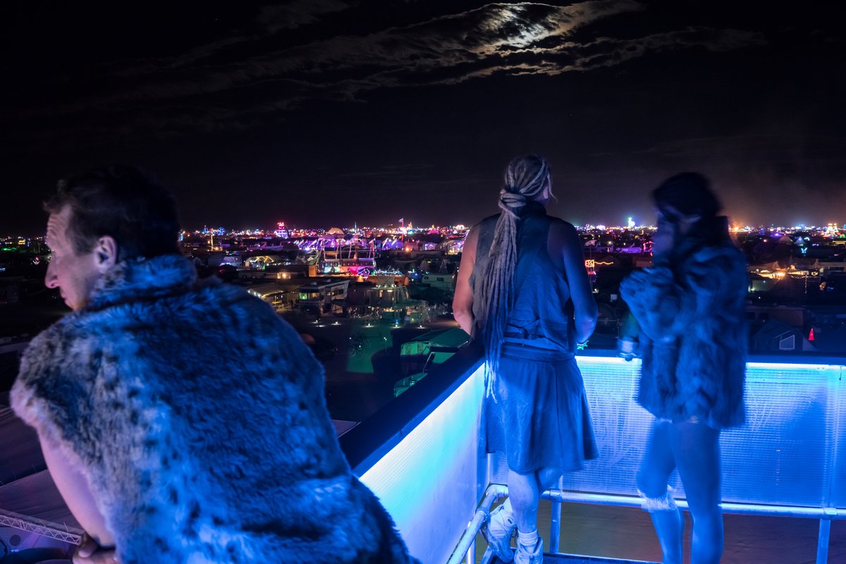 Three Burners Take In The View From The Panorama Viewing Platform At Night (creator's names unknown)