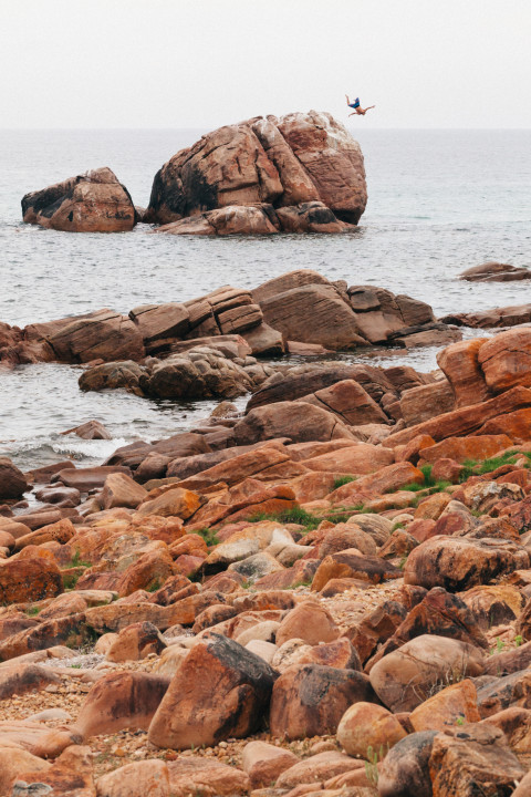 Man Jumping Into Ocean