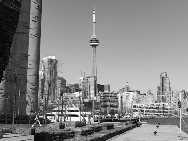 Girl Jumping And CN Tower