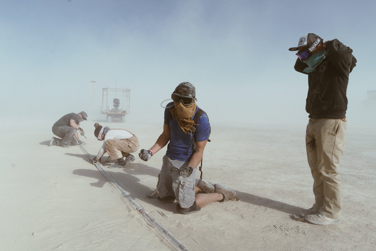 Justin and the One Ring Crew build the ring of lights around the man.