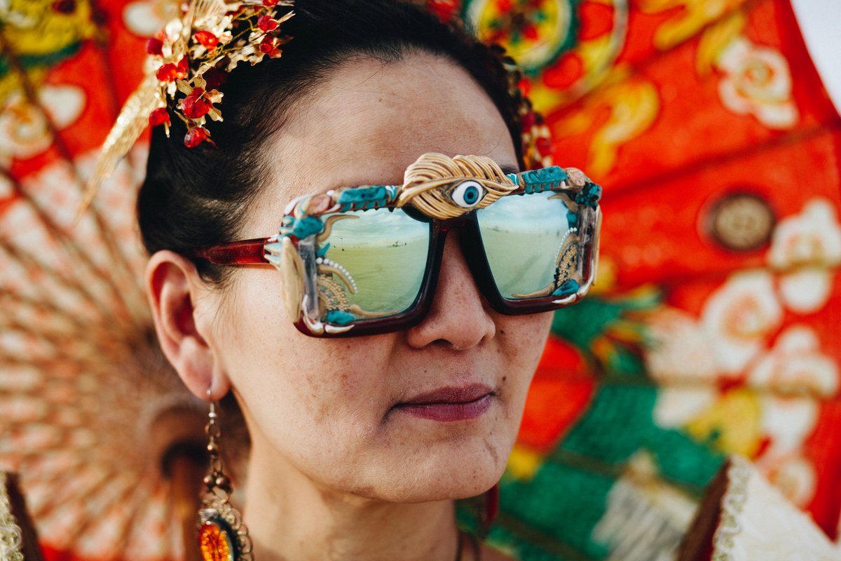 According to comment below: Jade Phoenix aka Tina Liu, Founder of artist collective Chinese Beyond Borders, bringing diversity to Black Rock City and the culture to Greater China