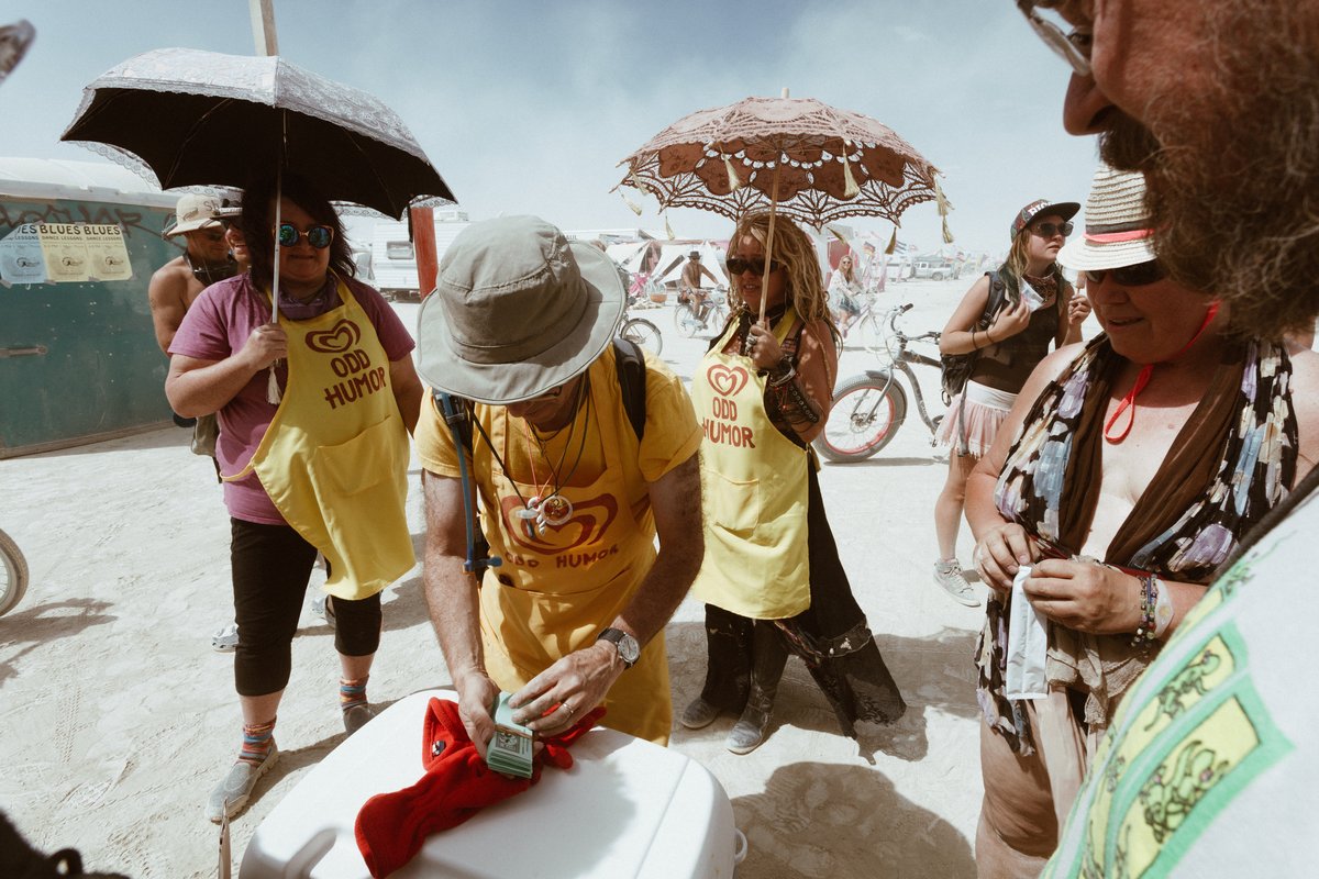Bob handing out dollars at Ice Cream "1 Dollar" (He intentionally trolls people by saying "Ice Cream 1 Dollar". Some folks get a little upset because you're not supposed to sell anything out there. Little do they know Bob is giving away ice cream and 1 "Dollar"... Classic!