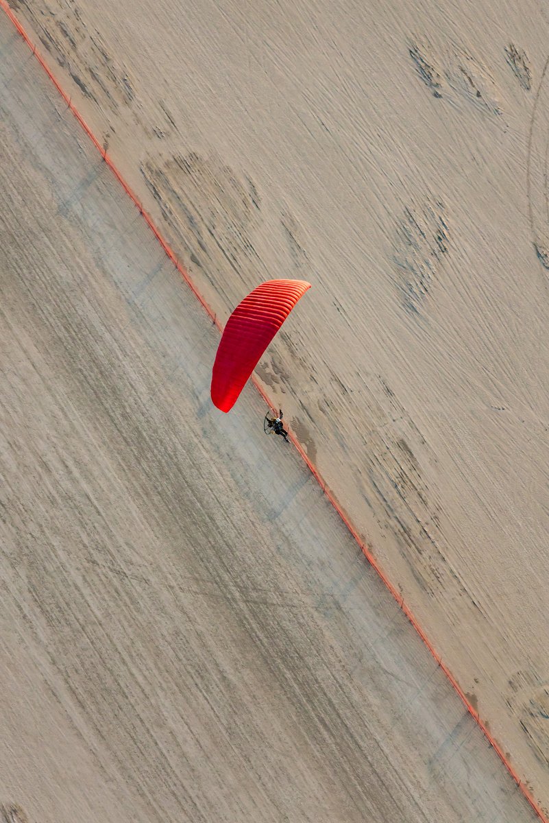 Paraglider And Matching Trash Fence