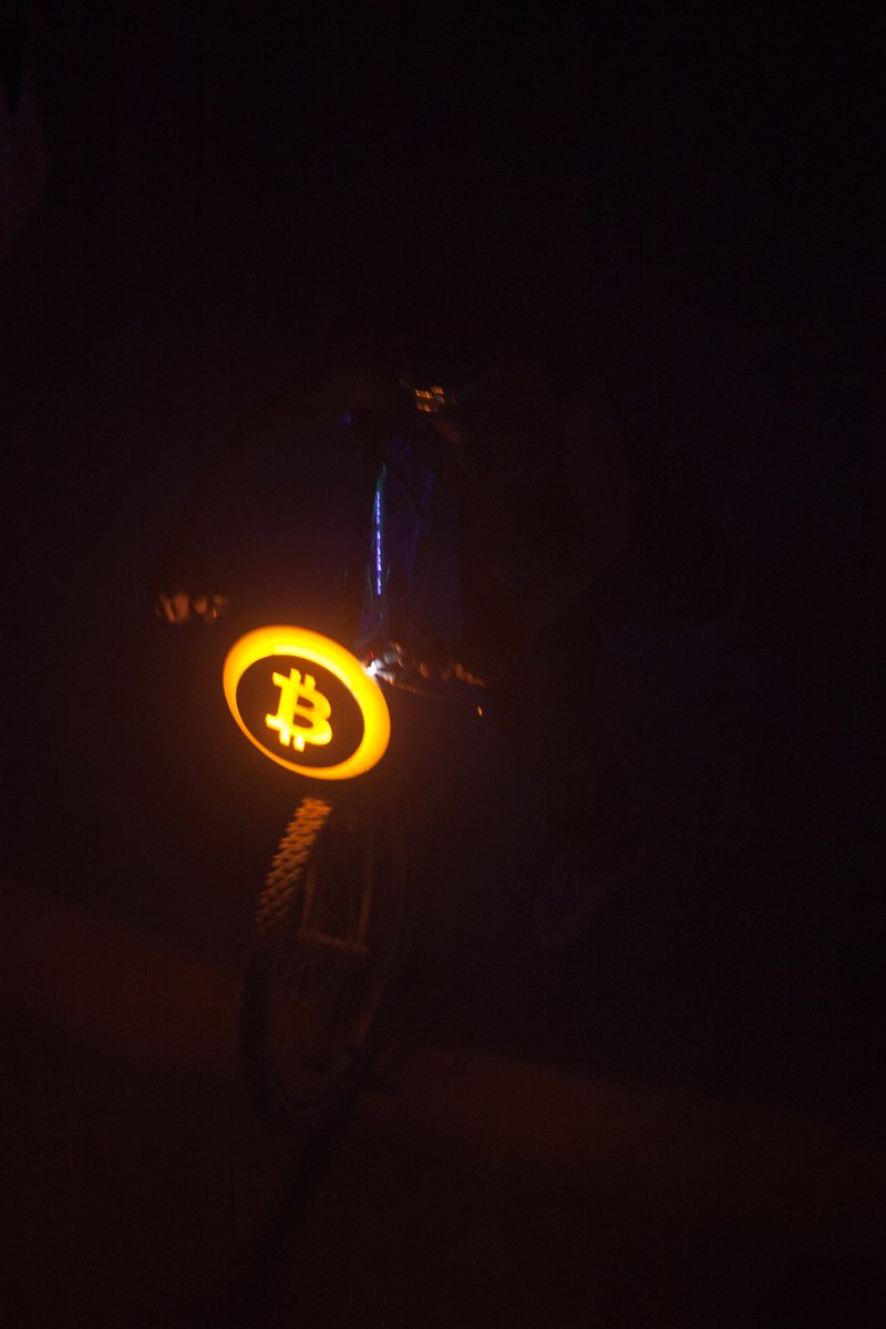 A Bitcoin Logo On A Bike
