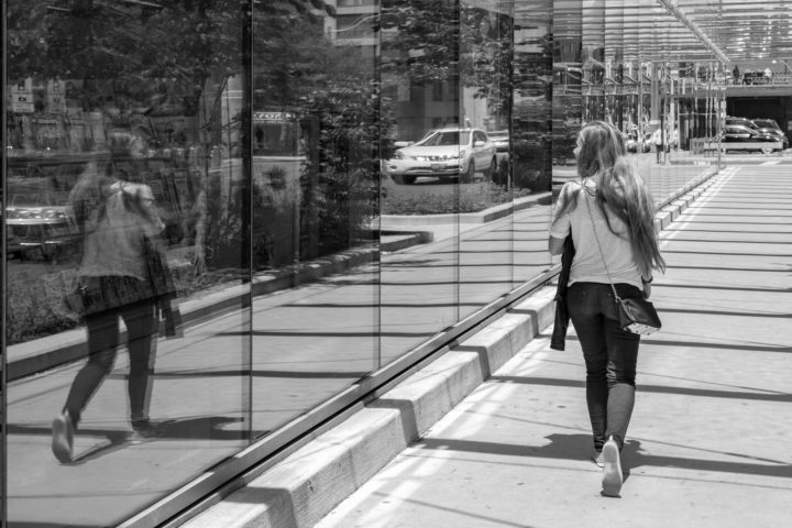 Woman Looking At Her Reflection