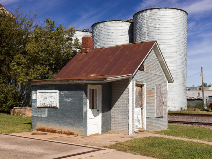 Abandoned Building And Silos
