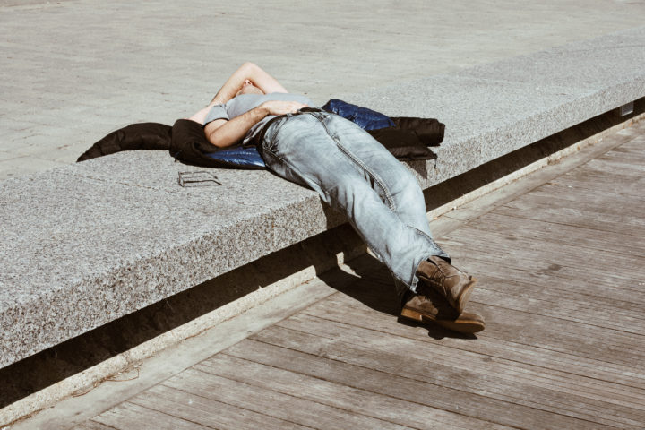 Man Resting On Bench