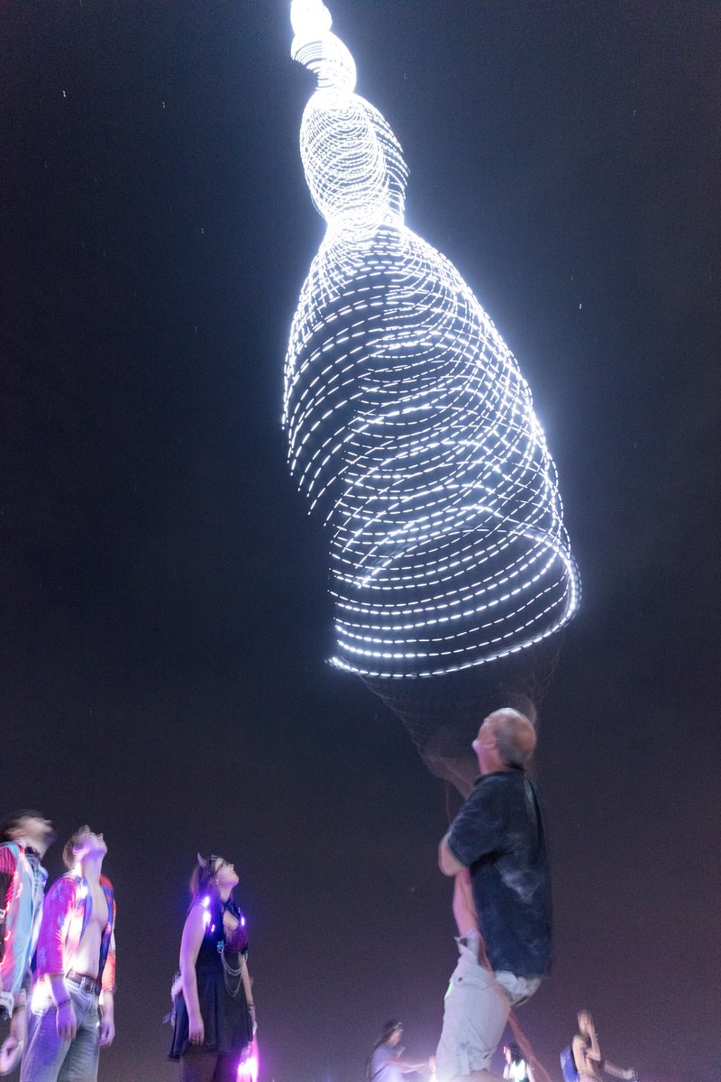 Burner Playing With Balloon With Long String Of LEDs On It (piece called Beanstalk by David Rattray. Thanks to Shane S for the caption update)