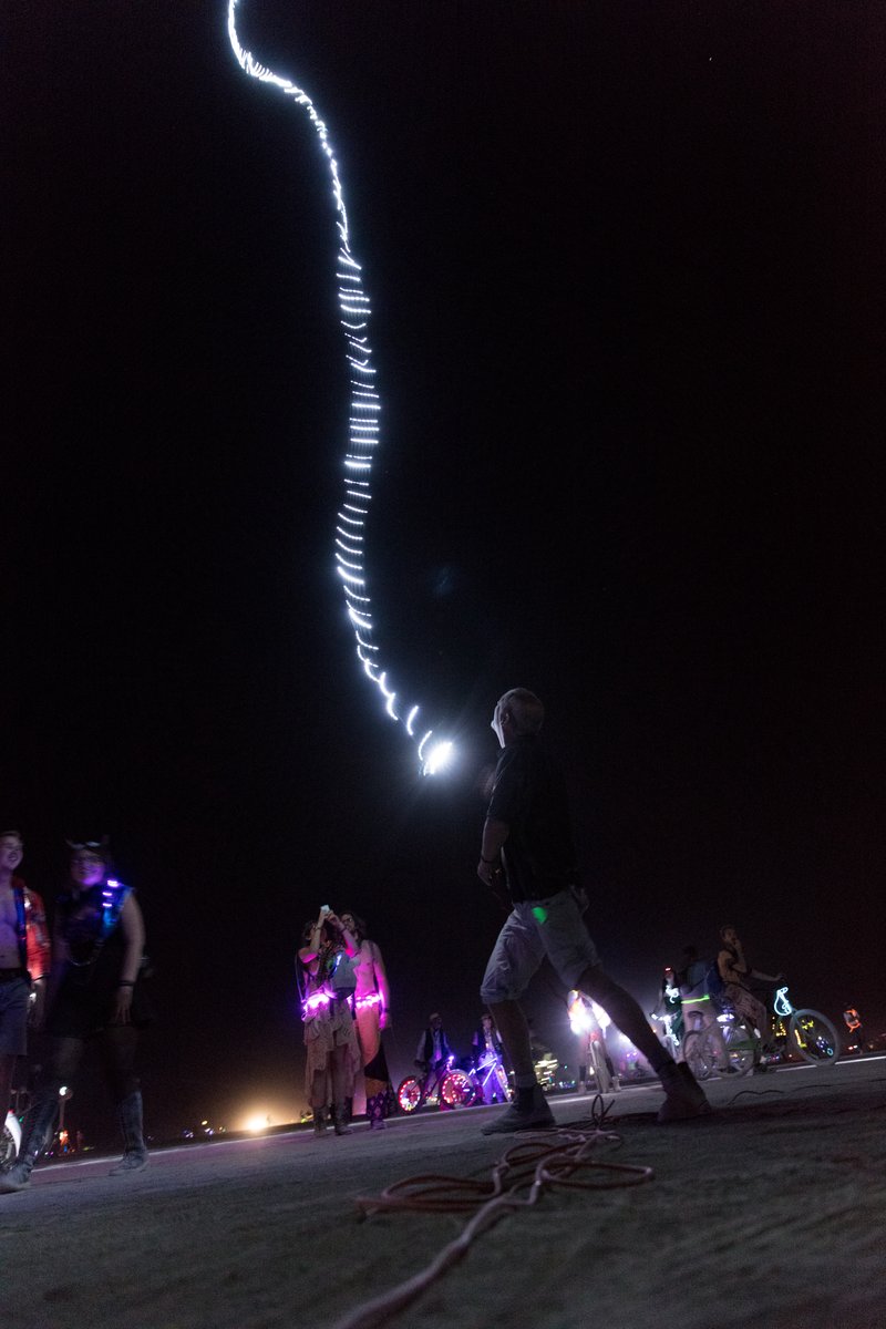 Burner Playing With Balloon With Long String Of LEDs On It (piece called Beanstalk by David Rattray. Thanks to Shane S for the caption update)