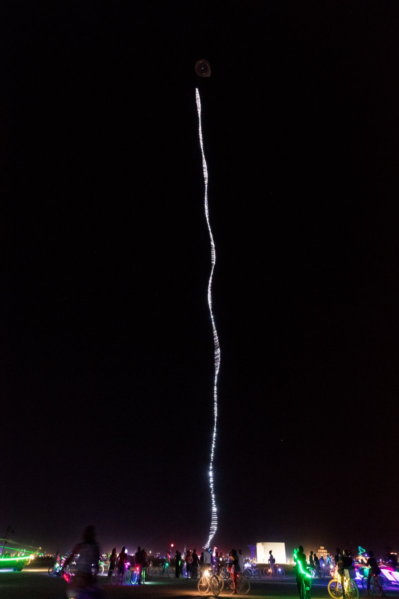 Burner Playing With Balloon With Long String Of LEDs On It (piece called Beanstalk by David Rattray. Thanks to Shane S for the caption update)