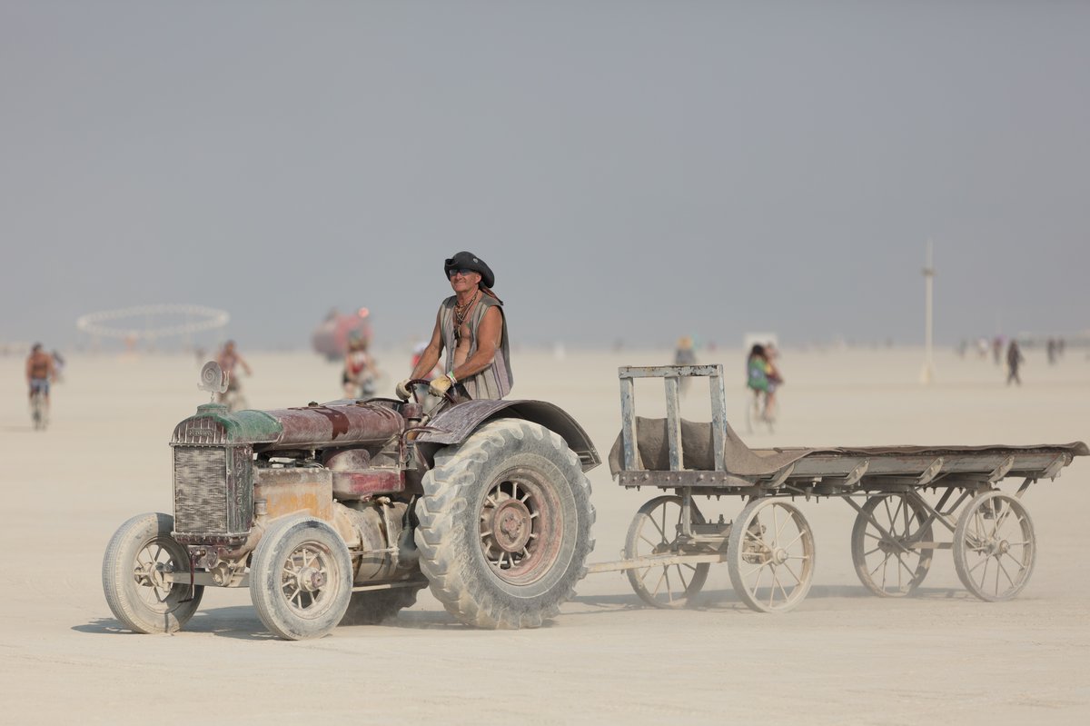 Purple Haze And His 1935 Fordson Tractor and 1880's Southern Pacific Railroad Baggage Wagon. He Often Uses It To To Shuttle People To And From The Airport