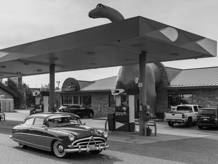 Vintage Car And Dinosaur Gas Station