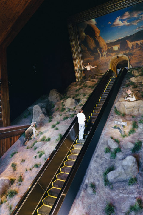 Man Riding Escalator