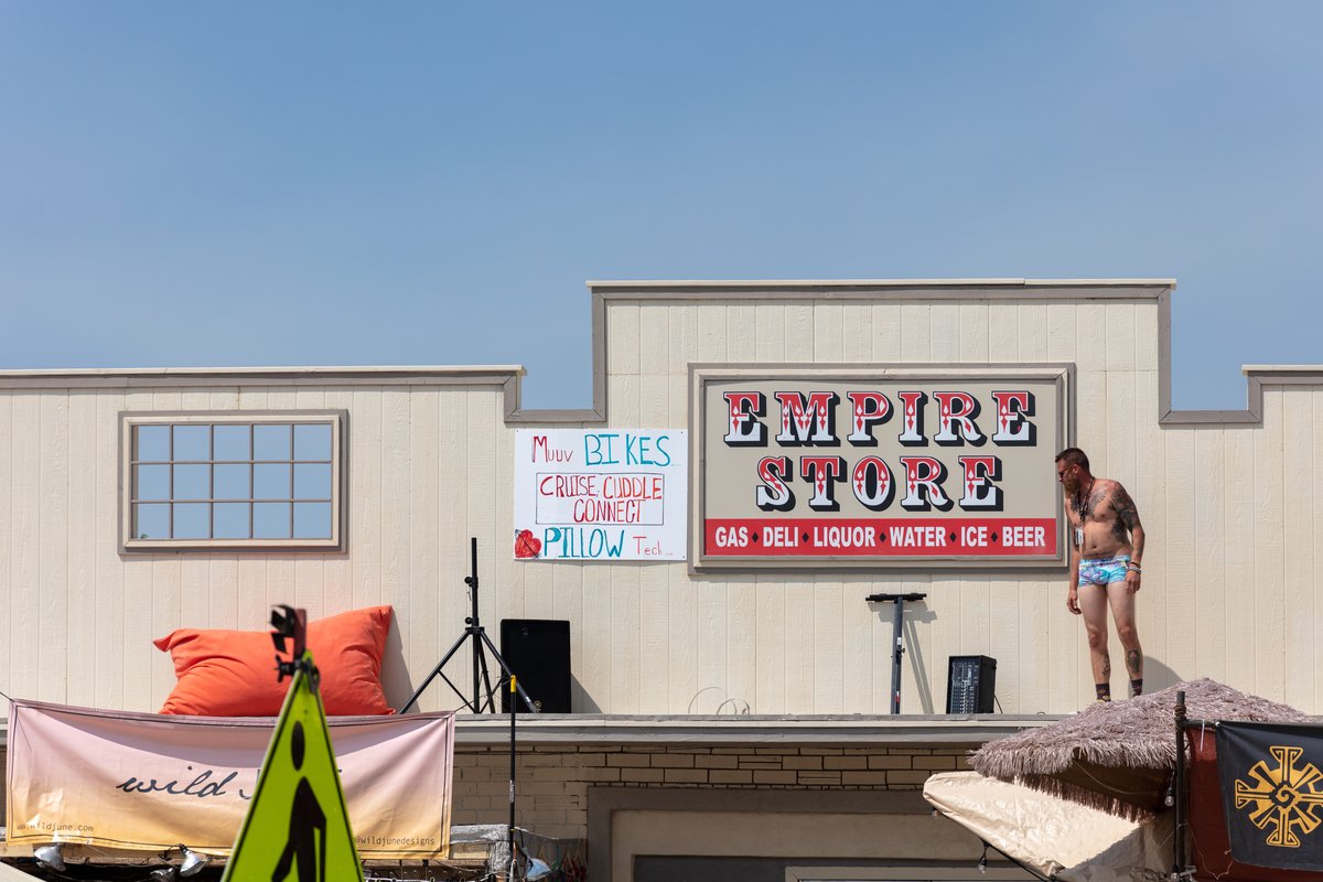 Burning Man is exhausting because barrage of stimulation begins long before you even get to the playa. Your brain has to deal with it all. Like what is this lovely man on the roof doing? Setting up to play live music I guess?