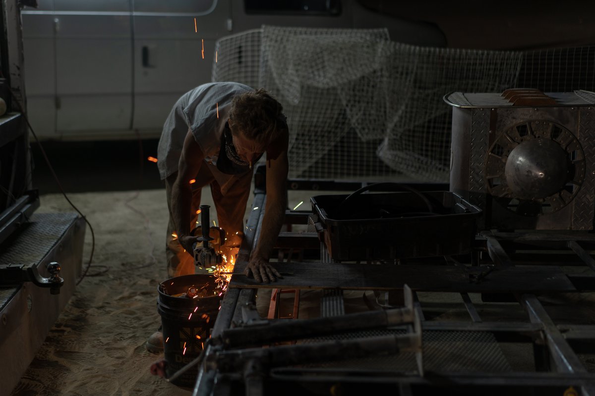 Create sparks for a few minutes. This will make the photographer happy and then they will leave you alone so you can do your work.