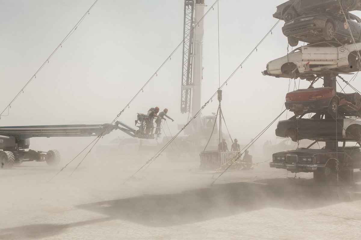 Night at the Climb In by: Dustin Weatherford from: Reno, NV year: 2018 Night at the Climb In will be a 70 foot tall stack of reclaimed junkyard cars, stacked straight up, one on top of the next. Every car will be climbable, visitable, interactive in its own way. The stack will end in a crows nest that sits at the top of the structure, just under a large spinning lit up sign. URL: https://www.facebook.com/nightattheclimbin/