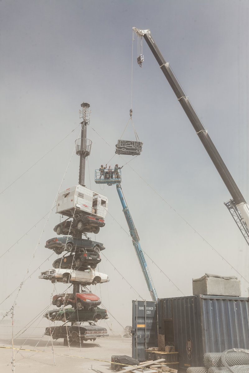 Night at the Climb In by: Dustin Weatherford from: Reno, NV year: 2018 Night at the Climb In will be a 70 foot tall stack of reclaimed junkyard cars, stacked straight up, one on top of the next. Every car will be climbable, visitable, interactive in its own way. The stack will end in a crows nest that sits at the top of the structure, just under a large spinning lit up sign. URL: https://www.facebook.com/nightattheclimbin/