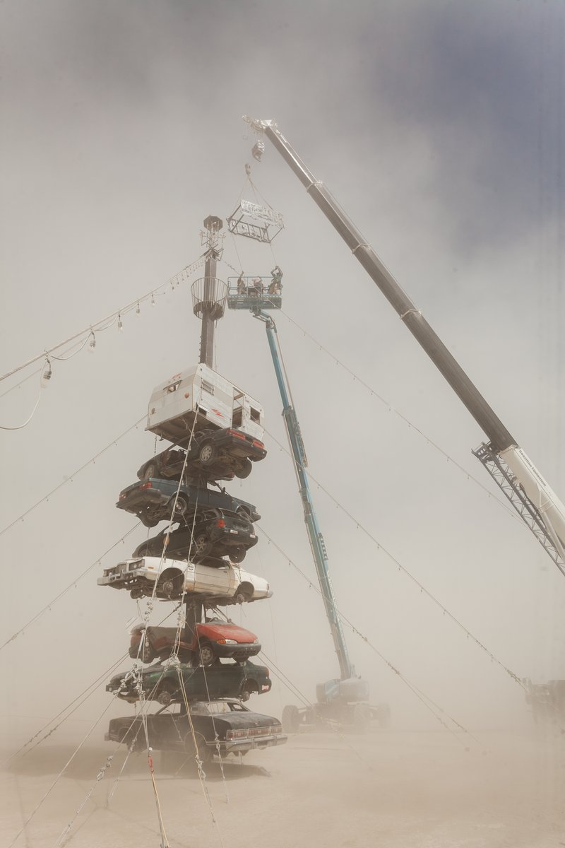 Night at the Climb In by: Dustin Weatherford from: Reno, NV year: 2018 Night at the Climb In will be a 70 foot tall stack of reclaimed junkyard cars, stacked straight up, one on top of the next. Every car will be climbable, visitable, interactive in its own way. The stack will end in a crows nest that sits at the top of the structure, just under a large spinning lit up sign. URL: https://www.facebook.com/nightattheclimbin/