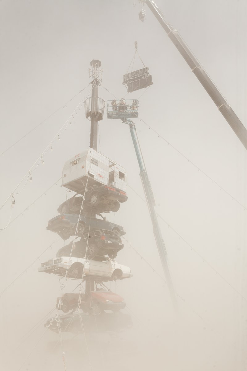 Night at the Climb In by: Dustin Weatherford from: Reno, NV year: 2018 Night at the Climb In will be a 70 foot tall stack of reclaimed junkyard cars, stacked straight up, one on top of the next. Every car will be climbable, visitable, interactive in its own way. The stack will end in a crows nest that sits at the top of the structure, just under a large spinning lit up sign. URL: https://www.facebook.com/nightattheclimbin/