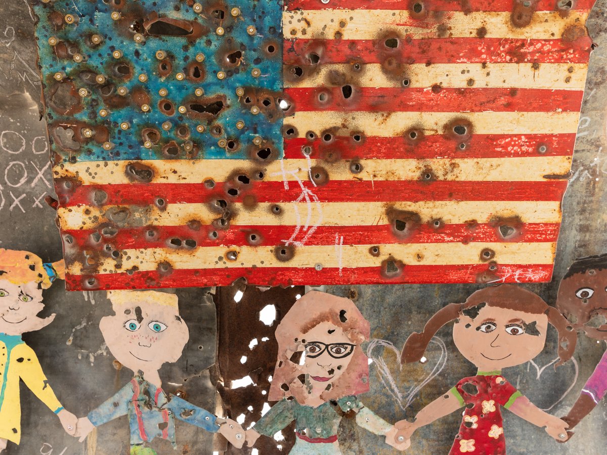 The Little Schoolhouse of Hope and Fear by: Gratis from: Vista, CA year: 2018 If all you had was the rough detritus of war, the cheap rubble of constant calamity, what would you build with it? A bunker, a church, or a school? Would you create a place of hope or fear? Of the past or for the future? Hope rising up from a violent and chaotic past, Fear transformed into building blocks: found metal, often riddled by gunre, torn by the wind and baked by the desert sun are incorporated into this replica of the traditional "little red schoolhouse." The Little Schoolhouse of Hope and Fear stands on the playa as a beacon to those who wish to teach a better way for the future, or to those ready to learn from the failures of the past.