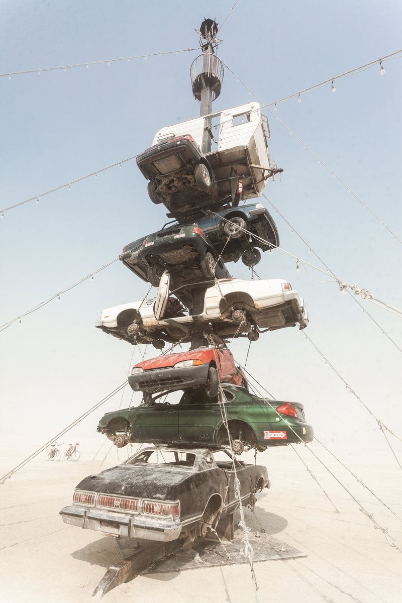 Night at the Climb In by: Dustin Weatherford from: Reno, NV year: 2018 Night at the Climb In will be a 70 foot tall stack of reclaimed junkyard cars, stacked straight up, one on top of the next. Every car will be climbable, visitable, interactive in its own way. The stack will end in a crows nest that sits at the top of the structure, just under a large spinning lit up sign. URL: https://www.facebook.com/nightattheclimbin/