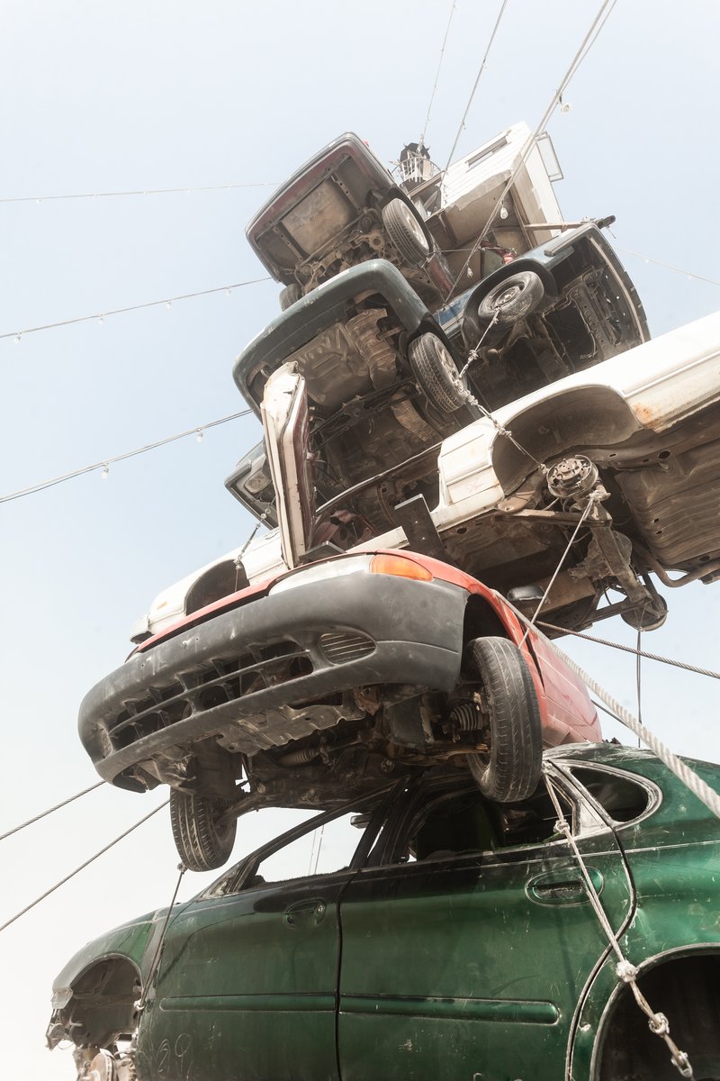 Night at the Climb In by: Dustin Weatherford from: Reno, NV year: 2018 Night at the Climb In will be a 70 foot tall stack of reclaimed junkyard cars, stacked straight up, one on top of the next. Every car will be climbable, visitable, interactive in its own way. The stack will end in a crows nest that sits at the top of the structure, just under a large spinning lit up sign. URL: https://www.facebook.com/nightattheclimbin/