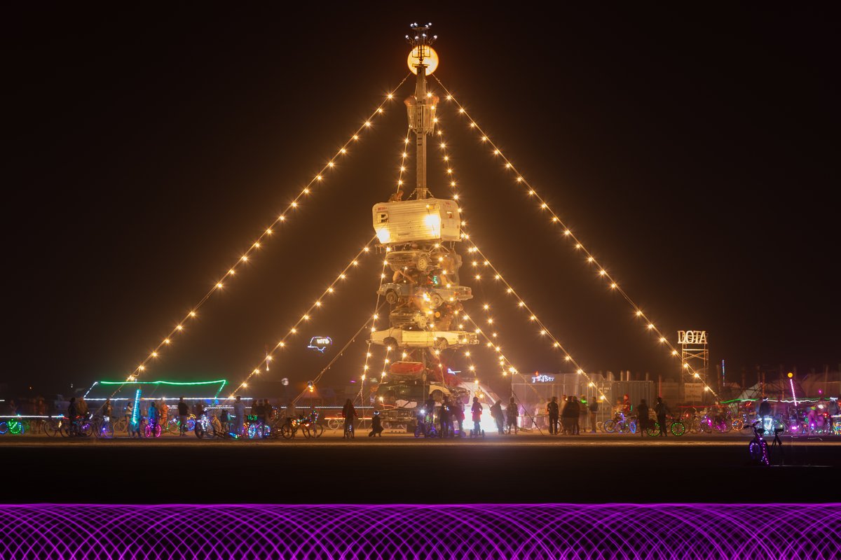 Night at the Climb In by: Dustin Weatherford from: Reno, NV year: 2018 Night at the Climb In will be a 70 foot tall stack of reclaimed junkyard cars, stacked straight up, one on top of the next. Every car will be climbable, visitable, interactive in its own way. The stack will end in a crows nest that sits at the top of the structure, just under a large spinning lit up sign. URL: https://www.facebook.com/nightattheclimbin/