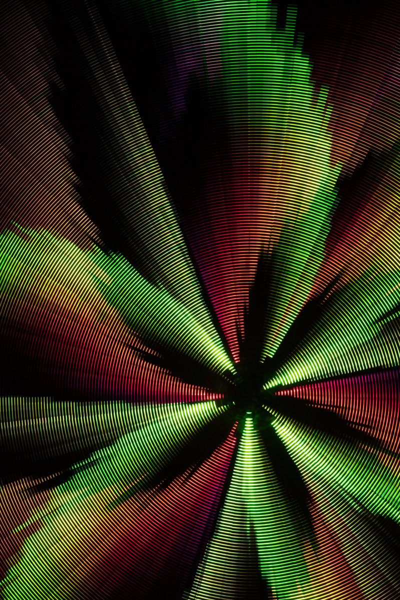 Paraluna by: Christopher Schardt from: Oakland, CA year: 2018 Paraluna combines kinetic sculpture, LEDs and music. Its main component is a disc 10m in diameter with 17,280 LEDs. A computer controls the LEDs while rotating, raising, lowering, and tilting the disc. Some of the LED patterns work with the rotation of the disk, creating spirals. Others use persistence-of-vision, making an image hover in space above the spinning LEDs. Spokes demonstrates both of these styles: https://photos.app.goo.gl/DcP9IauNTjRHENUh2 Surrounding the disc are several high-quality speakers that play classical music at comfortable, yet immersive volume, creating a comfortable, peaceful place to be. Patterns are chosen to complement each musical piece, as with Firmament: https://photos.app.goo.gl/H6KCzkf5jkGWAA3m2