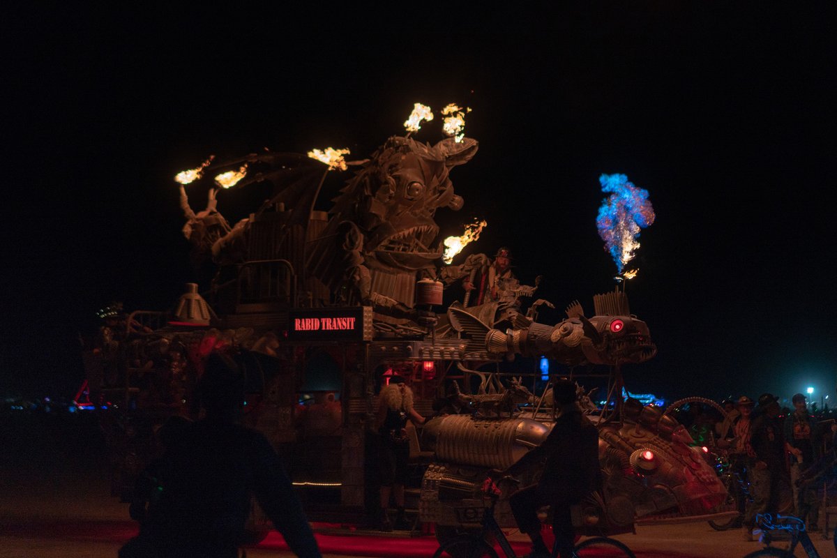 by Duane Flatmo and crew. (If you time it right you can catch a photo of the flame while it is blue! Notice the man on the "hood" area. I presume he is going to re-ignite the flame there.)