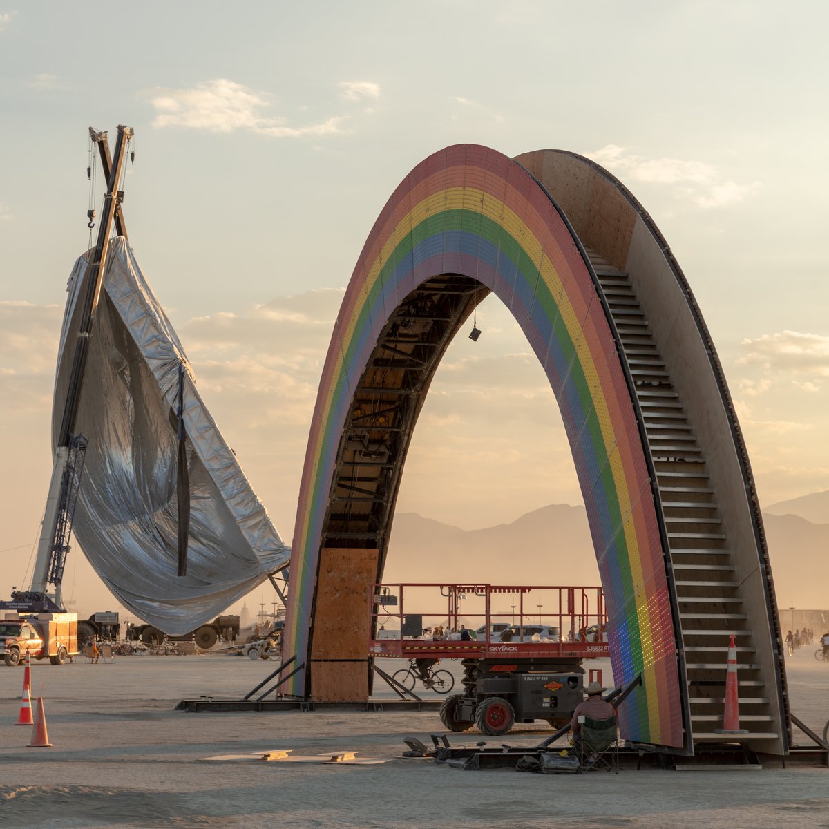 Where else on earth would you ever see a gigantic rainbow being built beside a giant orb?