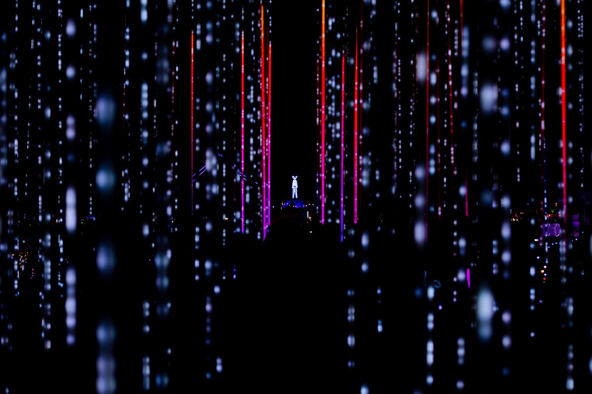 Hexatron by: Mark Lottor from: Menlo Park, CA year: 2018 A forest of 486 20ft tall LED light poles, arranged in a hexagon shape of approximately 90ft diameter, displaying 3D computer contr'd effects.