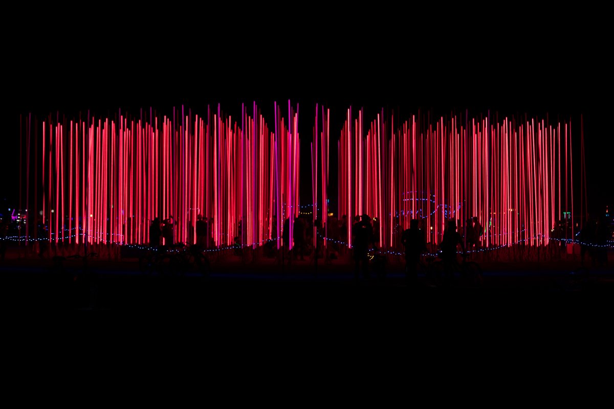Hexatron by: Mark Lottor from: Menlo Park, CA year: 2018 A forest of 486 20ft tall LED light poles, arranged in a hexagon shape of approximately 90ft diameter, displaying 3D computer contr'd effects.