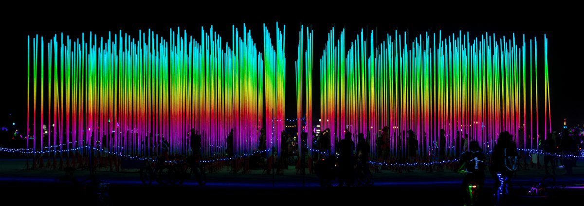 Hexatron by: Mark Lottor from: Menlo Park, CA year: 2018 A forest of 486 20ft tall LED light poles, arranged in a hexagon shape of approximately 90ft diameter, displaying 3D computer contr'd effects.