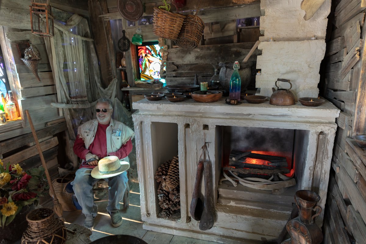 Baba Yaga's House by: Jessi Sprocket Janusee and Baba Yaga's Book Club from: Reno, NV year: 2018 The house of Baba Yaga will rise from the playa straddling it's mechanical chicken legs. The crone's house will be poised to run at the slightest provocation. Ascend her staircases to test the old witch if you dare. Are you able to walk through the veil of mortality into the space where the seer dwells? If you are strong of will, feeling bold and willing to show vulnerability she may allow you to venture within her sanctum. URL: http://jessisprocket.com/baba-yaga/
