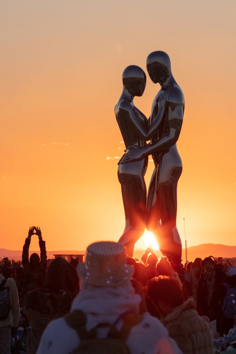 In Every Lifetime I Will Find You by: Michael Benisty, Love and Unity from: Brooklyn, NY year: 2018 A sculptural representation of Male and Female holding one another in a symbolic and universal position of caring in a display of Love and Unity. Measuring 25 feet tall and made out of mirror polished stainless steel.
