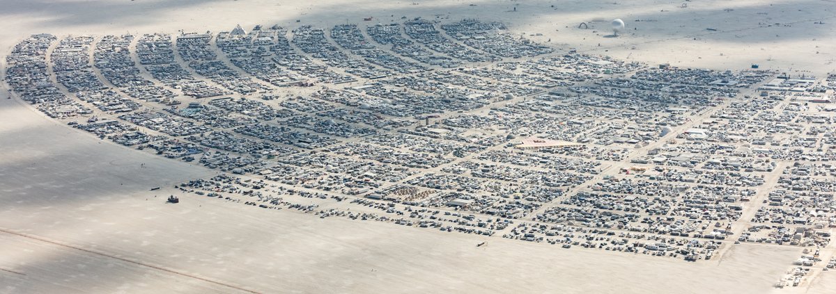 This aerial photograph of Black Rock City was shot on the morning of Friday August 31st, 2018 during Burning Man 2018. The pilot of the aircraft was Purple Haze.