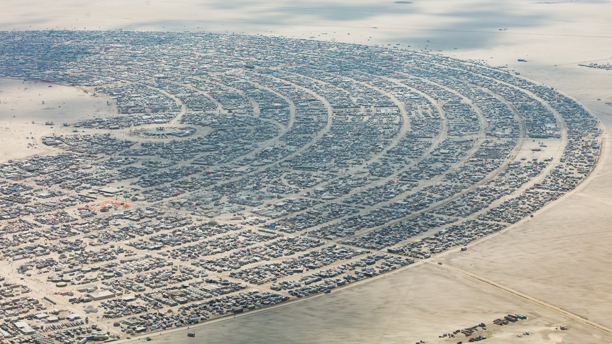 This aerial photograph of Black Rock City was shot on the morning of Friday August 31st, 2018 during Burning Man 2018. The pilot of the aircraft was Purple Haze.
